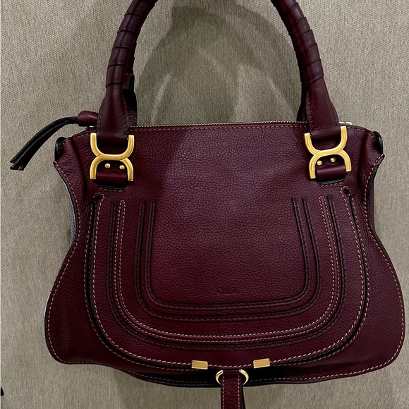 Chloe Handbag styled in pebbled Dark Velvet calfskin...